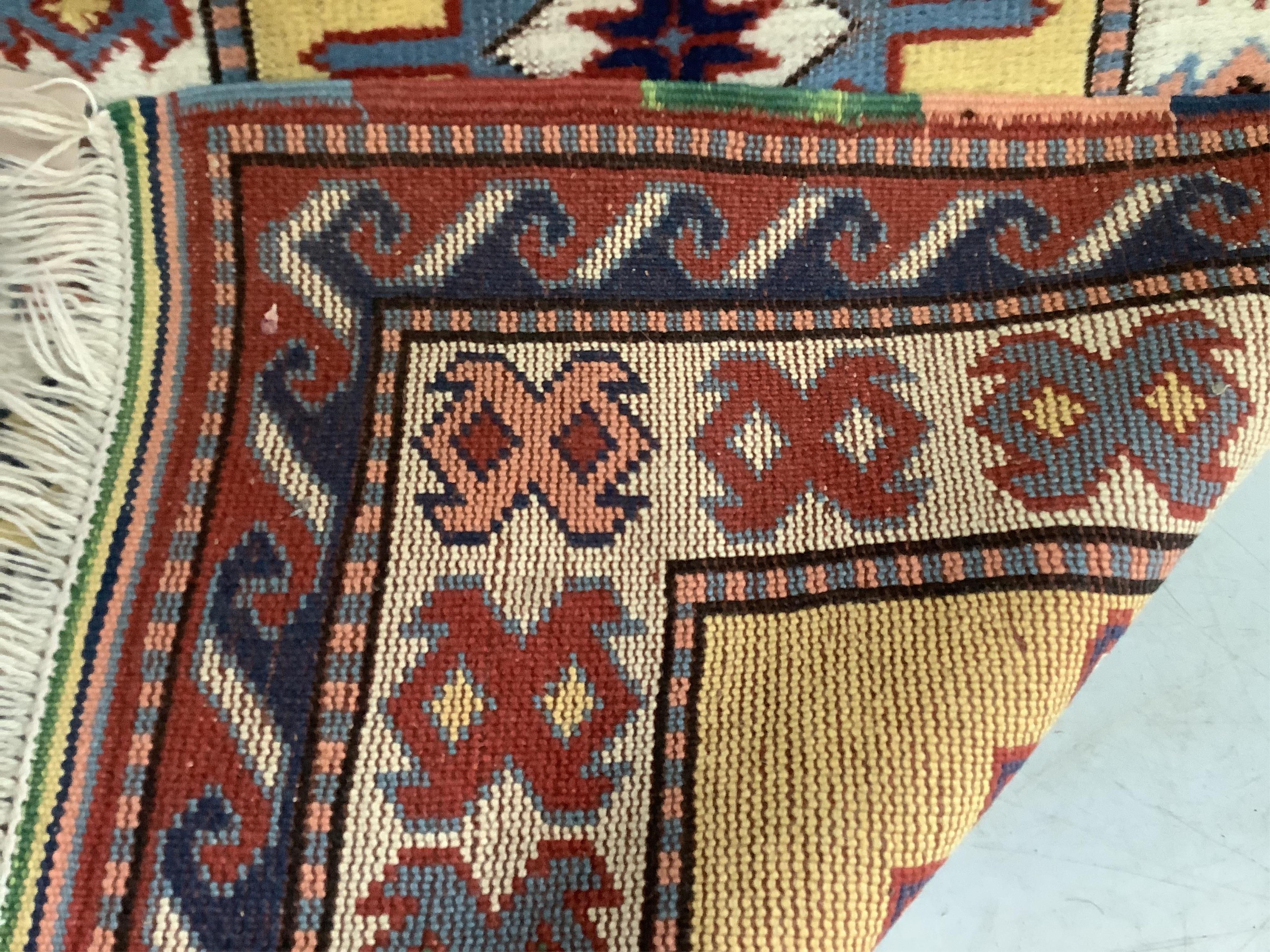 A Caucasian style gold ground runner, 300 x 80cm. Condition - fair